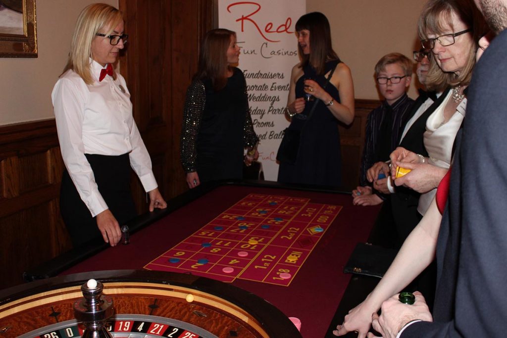 People playing roulette at a casino party event