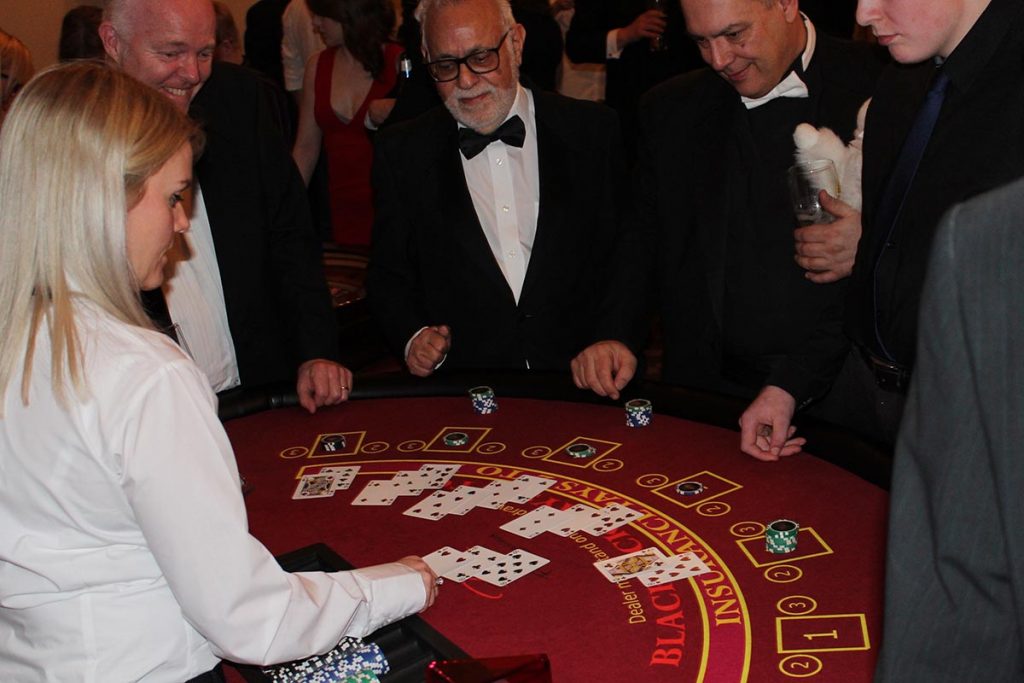 Players playing blackjack at fun casino party