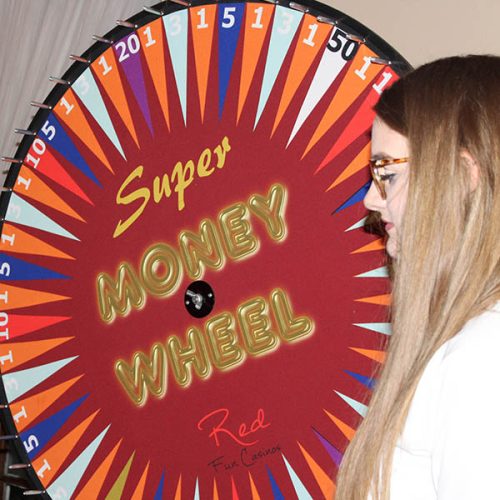 Close up of casino wheel of fortune with young lady looking on