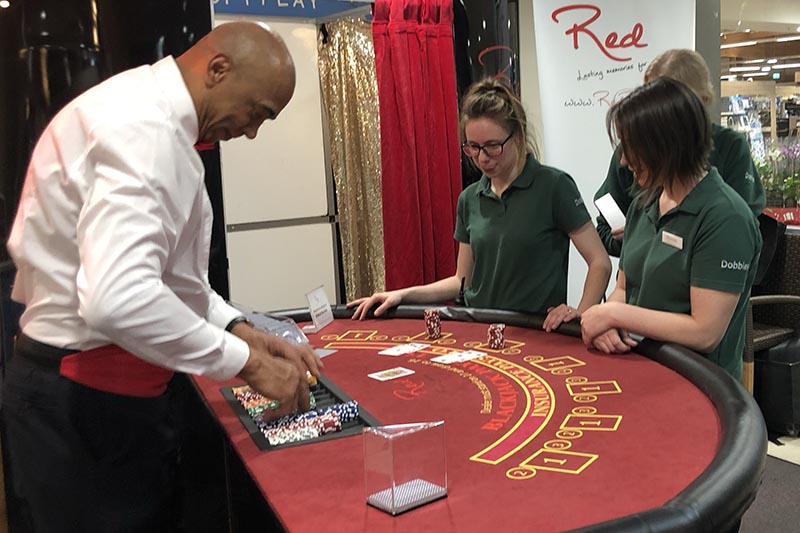 Staff playing blackjack at a team building event